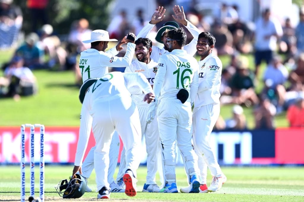 Mominul Haque is congratulated by his team-mates, New Zealand vs Bangladesh, 1st Test, 2022 © Getty Images