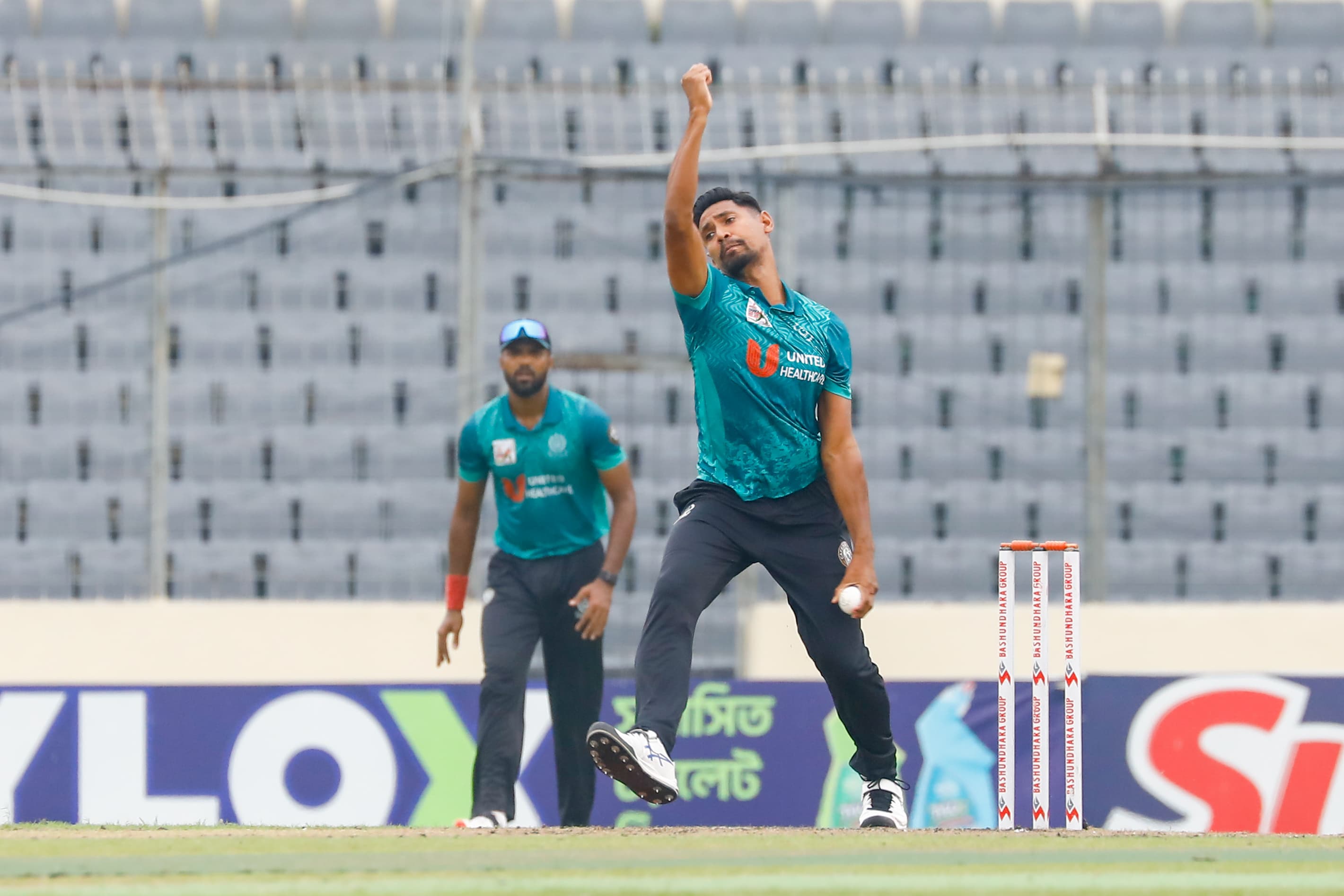 Mustafizur Rahman returns with the ball in DPL super six ©BDCricTime