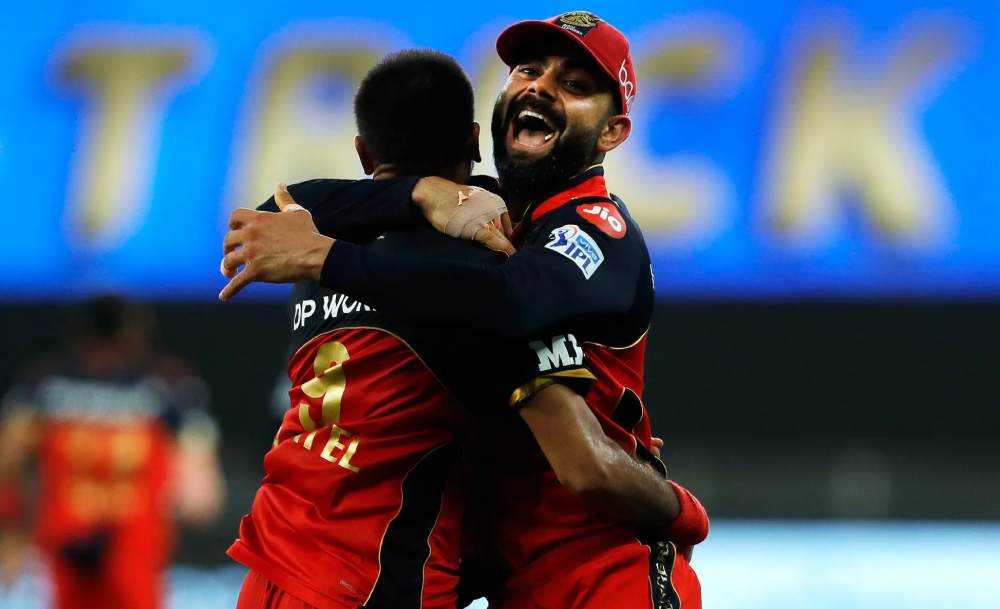 Skipper VIrat Kohli celebrates with hat-trick man Harshal Patel ©BCCI